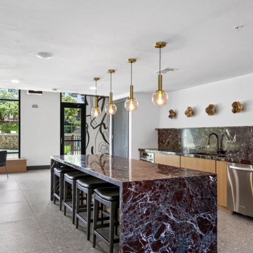 a room with a table and a large glass wall