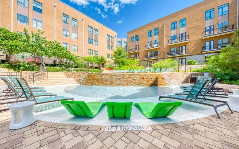 a swimming pool in front of a building